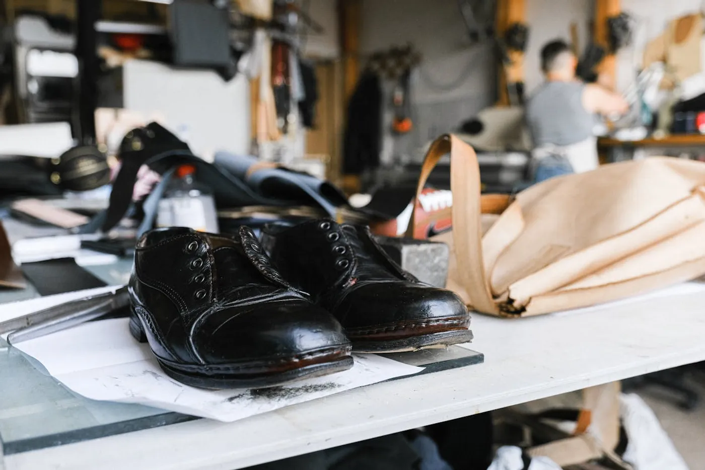 Shoe maker crafting footwear in a French workshop